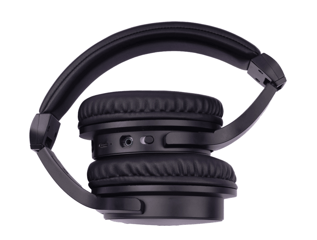 Wireless black over-ear headphones with cushioned ear cups and adjustable headband for comfortable listening. Includes volume control and audio jack for versatile use.